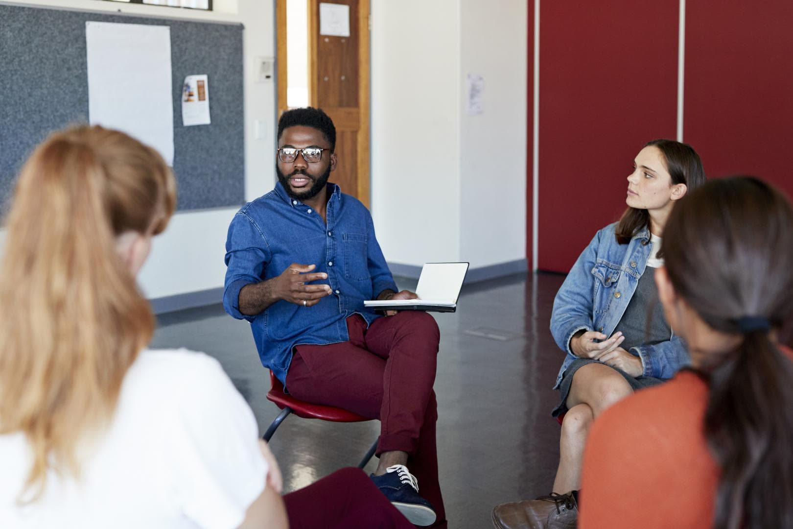 People sitting in a room in discussion