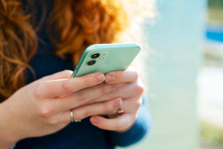 Close up shot of a woman using a smart phone