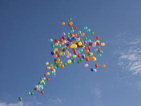 Colourful balloons floating in the sky