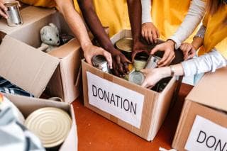 People making donations at a food bank