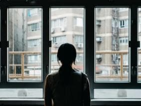 Woman staring out of the window