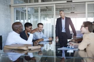 Manager leading a work meeting