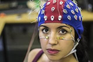 Woman wearing EEG cap