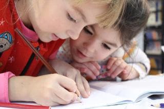 Two girls doing schoolwork