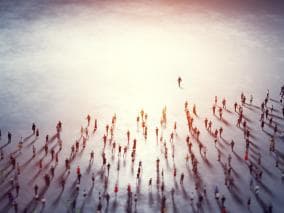 Crowd of people moving towards the horizon