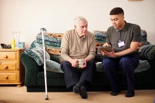 Care worker helps client