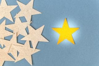 Gold star against cream stars