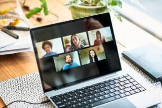 People of different ethnic backgrounds meet on a zoom call