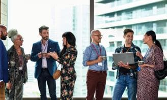 A group of people at a meet and greet in conference in an office complex