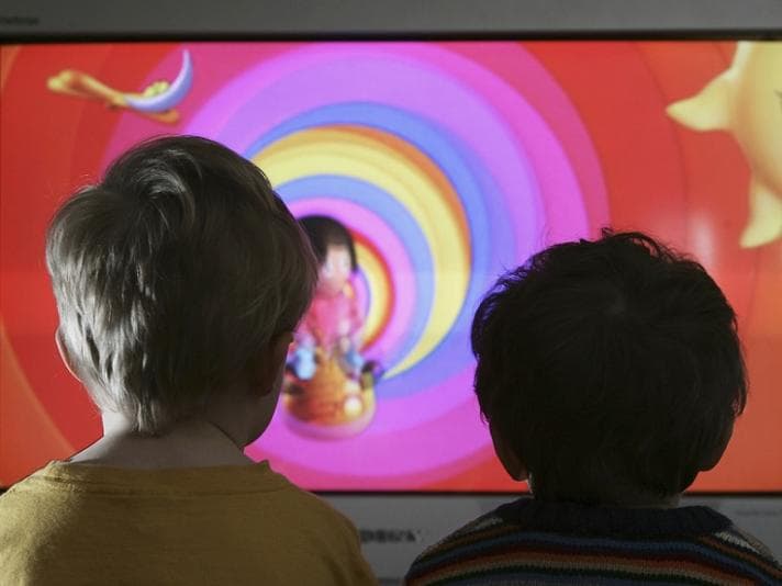 Children staring at a screen