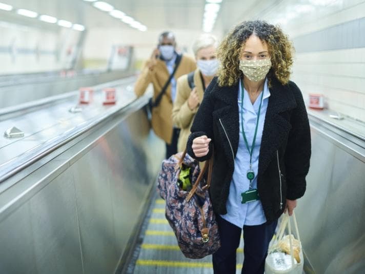 Commuters in masks