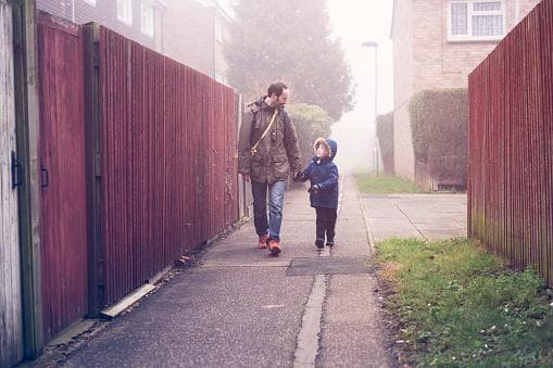 Father and son holding hands