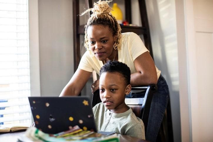 Mother and son learning online