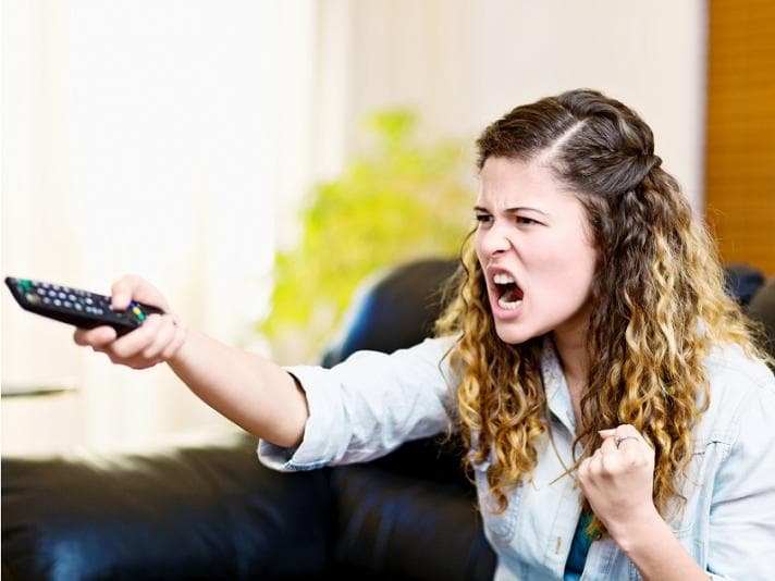 Woman yelling at the television