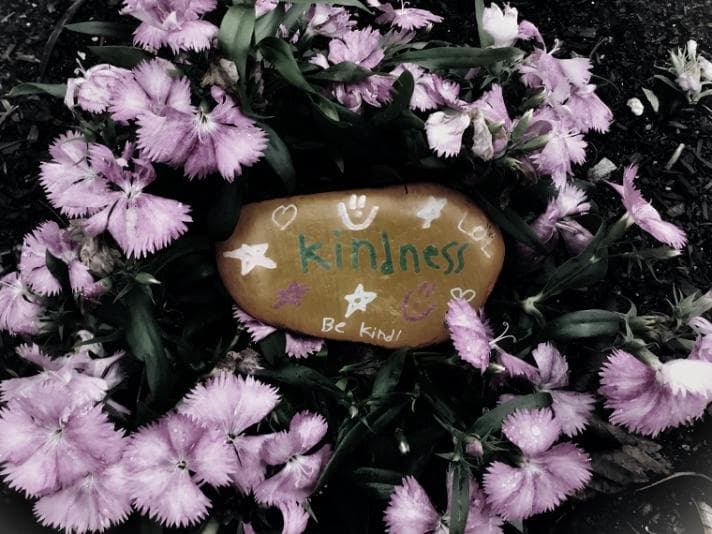 A rounded stone on which is written the word kindness