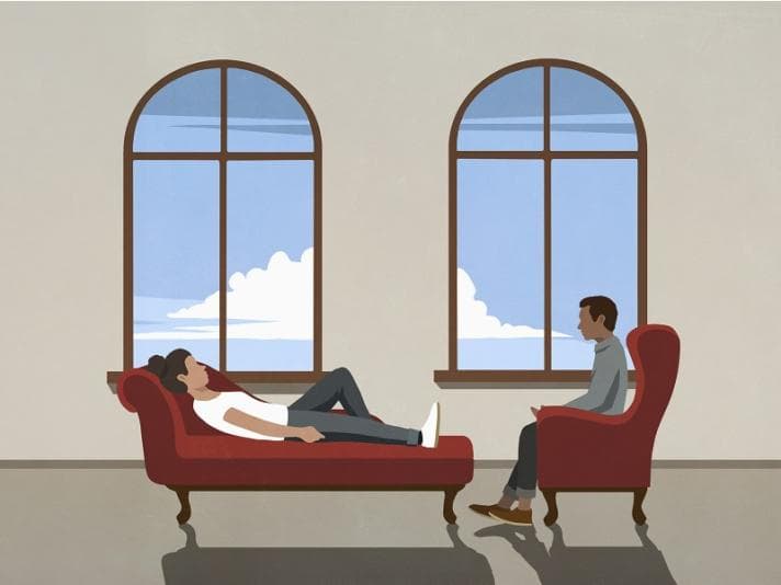 Cartoon of a therapist talking to a patient on the couch