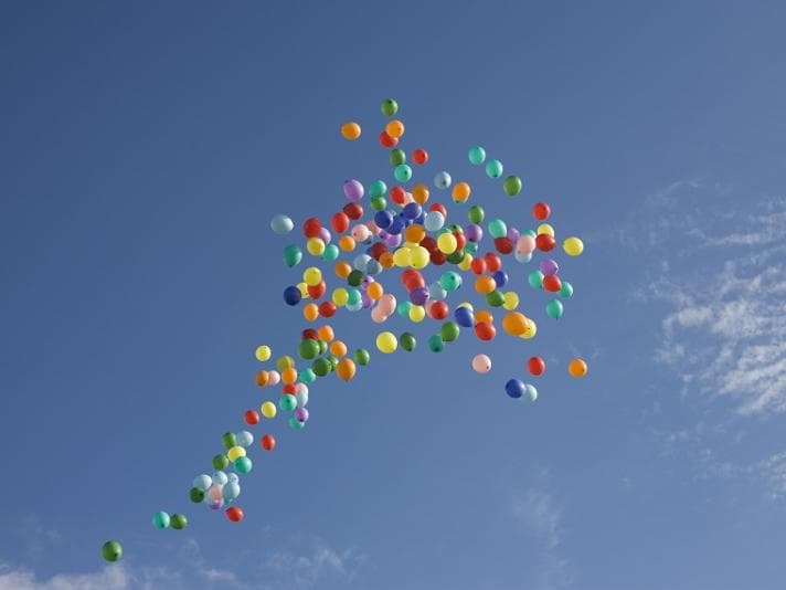 Colourful balloons floating in the sky