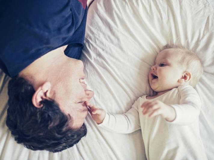 Father playing with baby