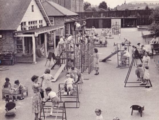 Old photo of children playing outside at school - copyright 2013 The British Association for Early Childhood Education