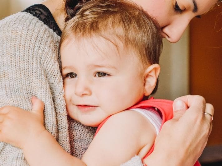 Woman holding child