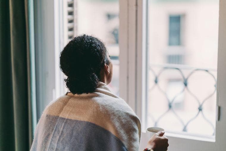 Woman staring out of the window