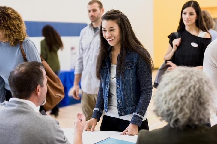 Woman smiling in a polling station