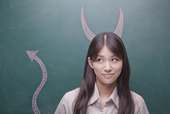 Young woman with devil horns and tail