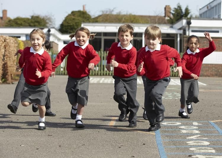 Children running in the playground at school