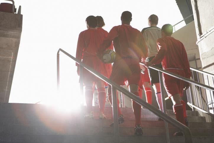 Football team entering stadium