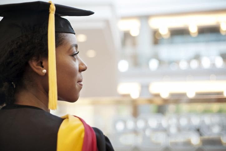 Graduate smiling and looking out ahead