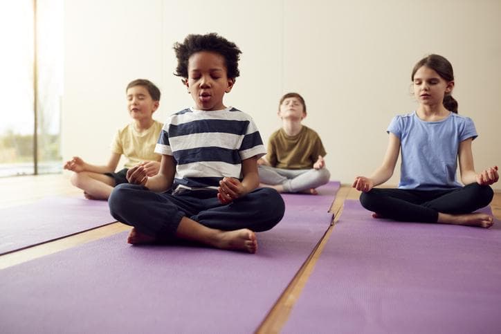 Group of children meditating