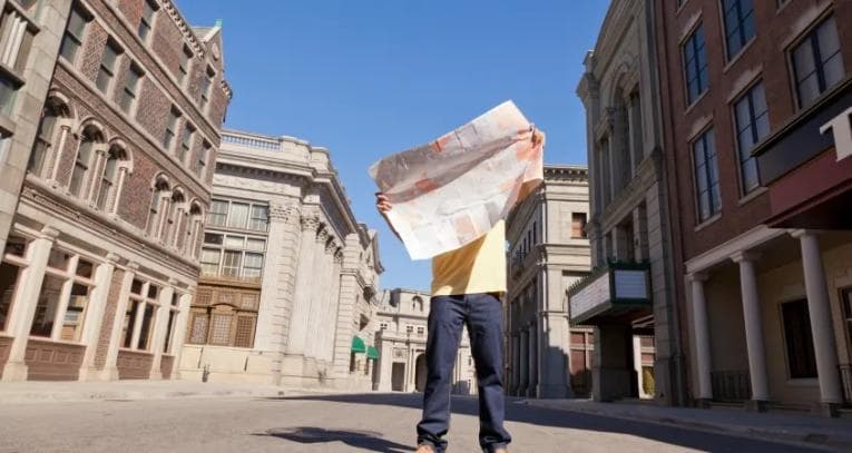 Man struggling to read map