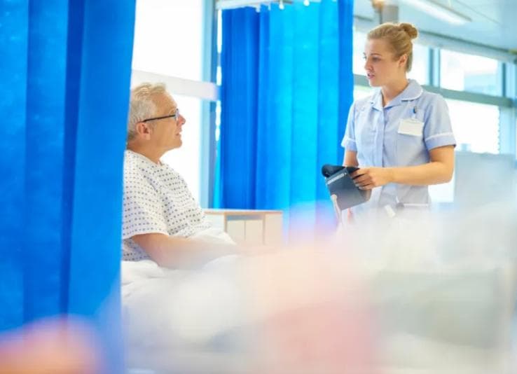 Nurse speaking to patient