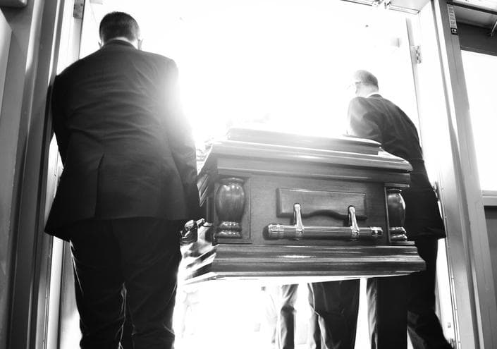 People carrying coffin