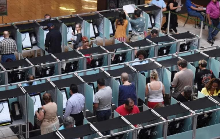 People using voting booths