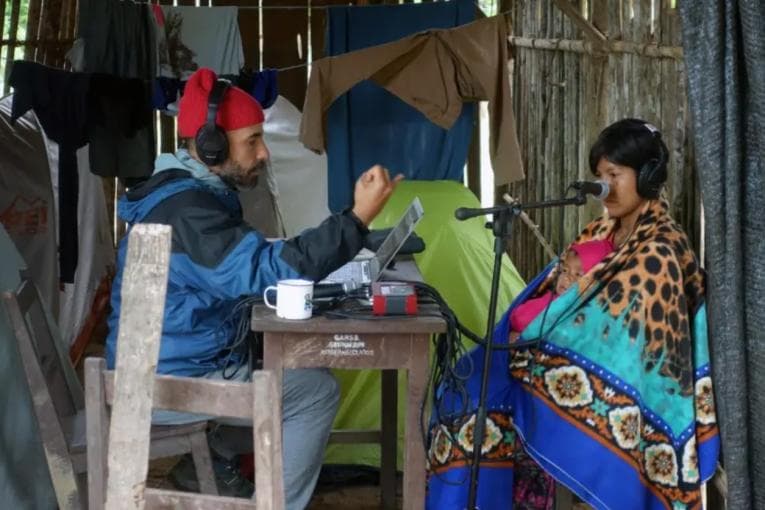 Researcher conducting pitch perception experiment with a member of the Tsimane’ tribe - Credit. Josh McDermott