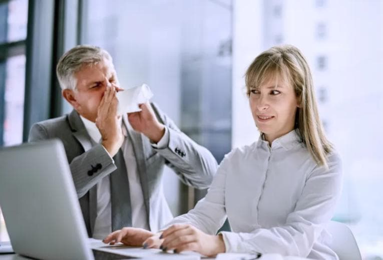 Woman in the office looking disgusted