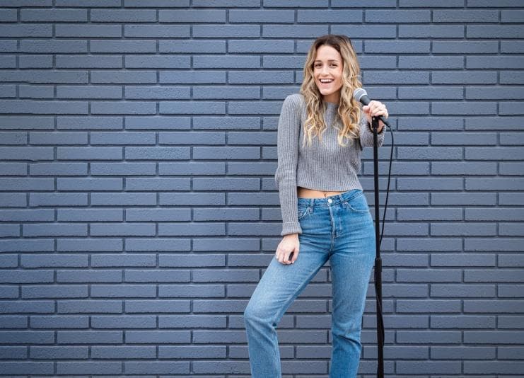 Young woman doing stand-up comedy