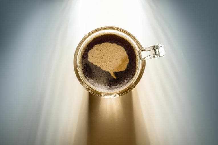 Brain image in the foam of a cup of coffee