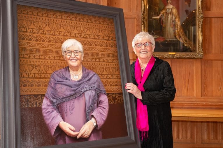 Carol McGuinness picture with portrait