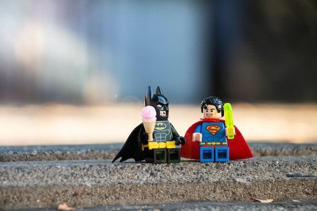 LEGO Batman and Superman eating LEGO ice creams