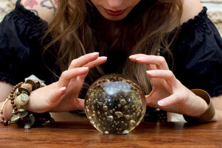 Woman looking into crystal ball