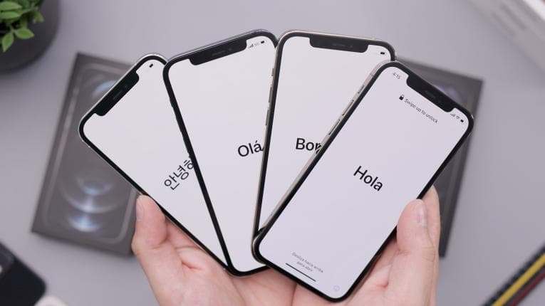 Four phones showing the word hello in different languages