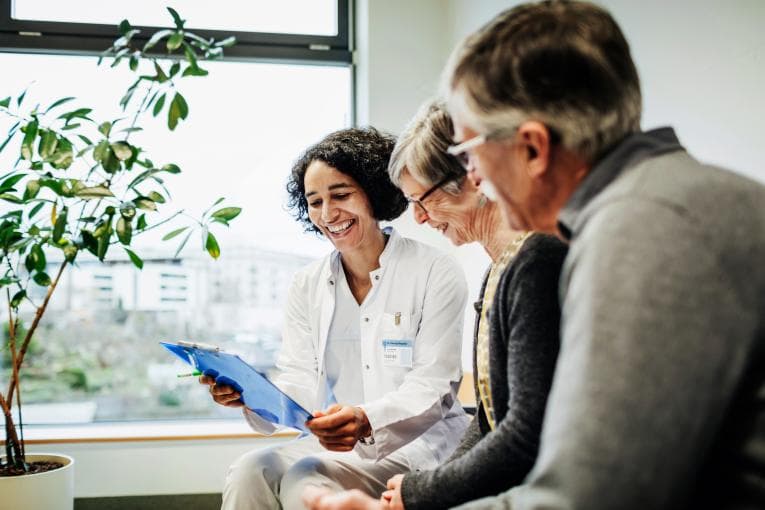 Nurse talking with patients