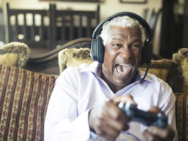 Older man playing video game