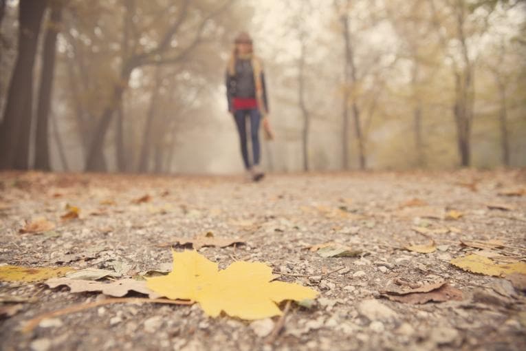 Woman walking in autumn