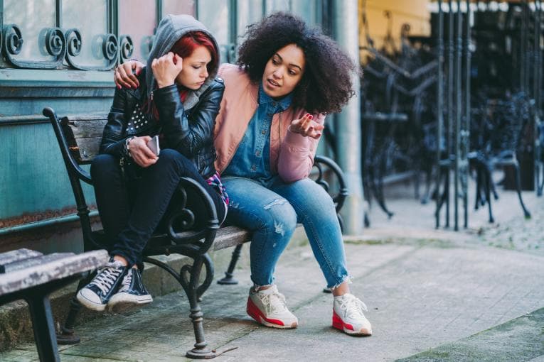 woman comforting her friend