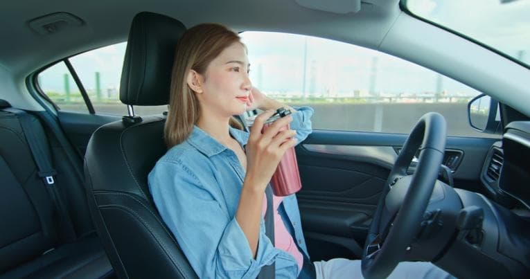 woman in self-driving car