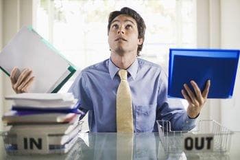 Man juggling several tasks at work