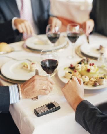 Mobile phone on dinner table